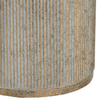 Detail of closely spaced vertical fluting on the gold pedestal, with pale recesses, mottled colouring and a narrow base rim.