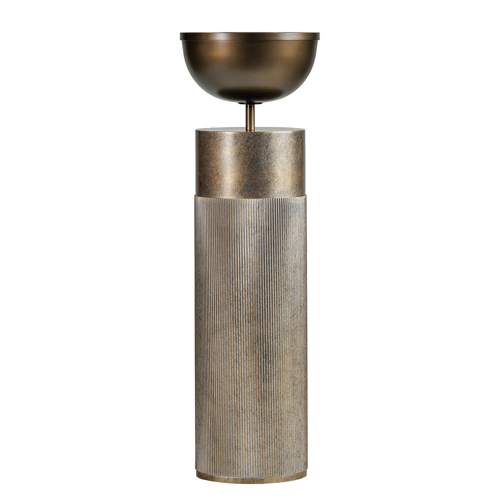 Full view of a gold pedestal planter with a rounded dark bowl above a tall cylindrical column with vertical fluting.
