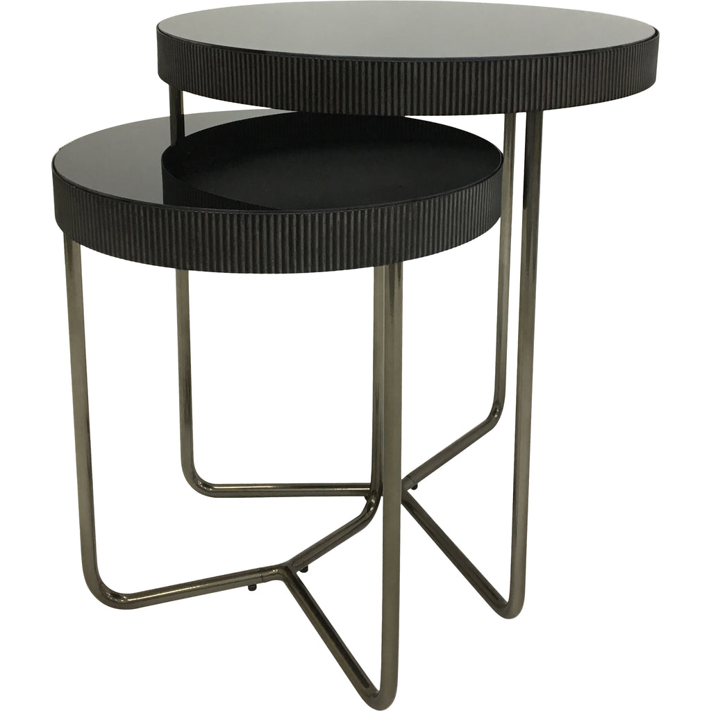Two round side tables at different heights, angled to show their dark mirrored tops, fluted rims and open metal bases.