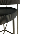Close view of the overlapping tables showing the vertical fluting around their dark glass tops and the slim metal legs.
