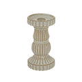 Cream candle holder on a white background, showing its wide circular top, central recess, curved fluted column and broad ribbed foot with warm brown accents.