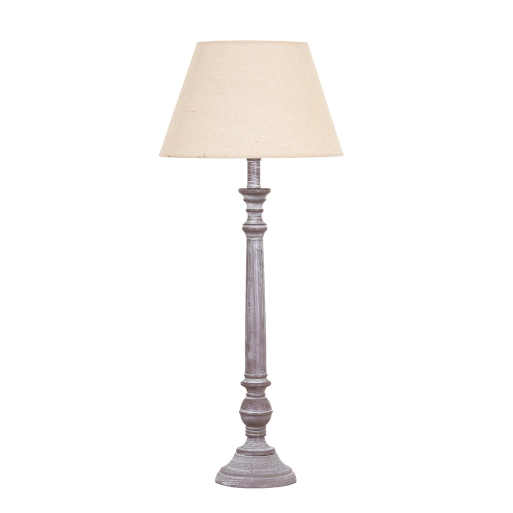 Fluted Run Table Lamp with a pale tapered shade, long grey fluted stem and rounded details above a stepped circular foot.