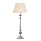 Fluted Run Table Lamp with a pale tapered shade, long grey fluted stem and rounded details above a stepped circular foot.
