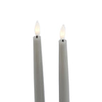 Close-up of the grey candle tops, showing white flame-shaped inserts with pale yellow centres on short dark stems.
