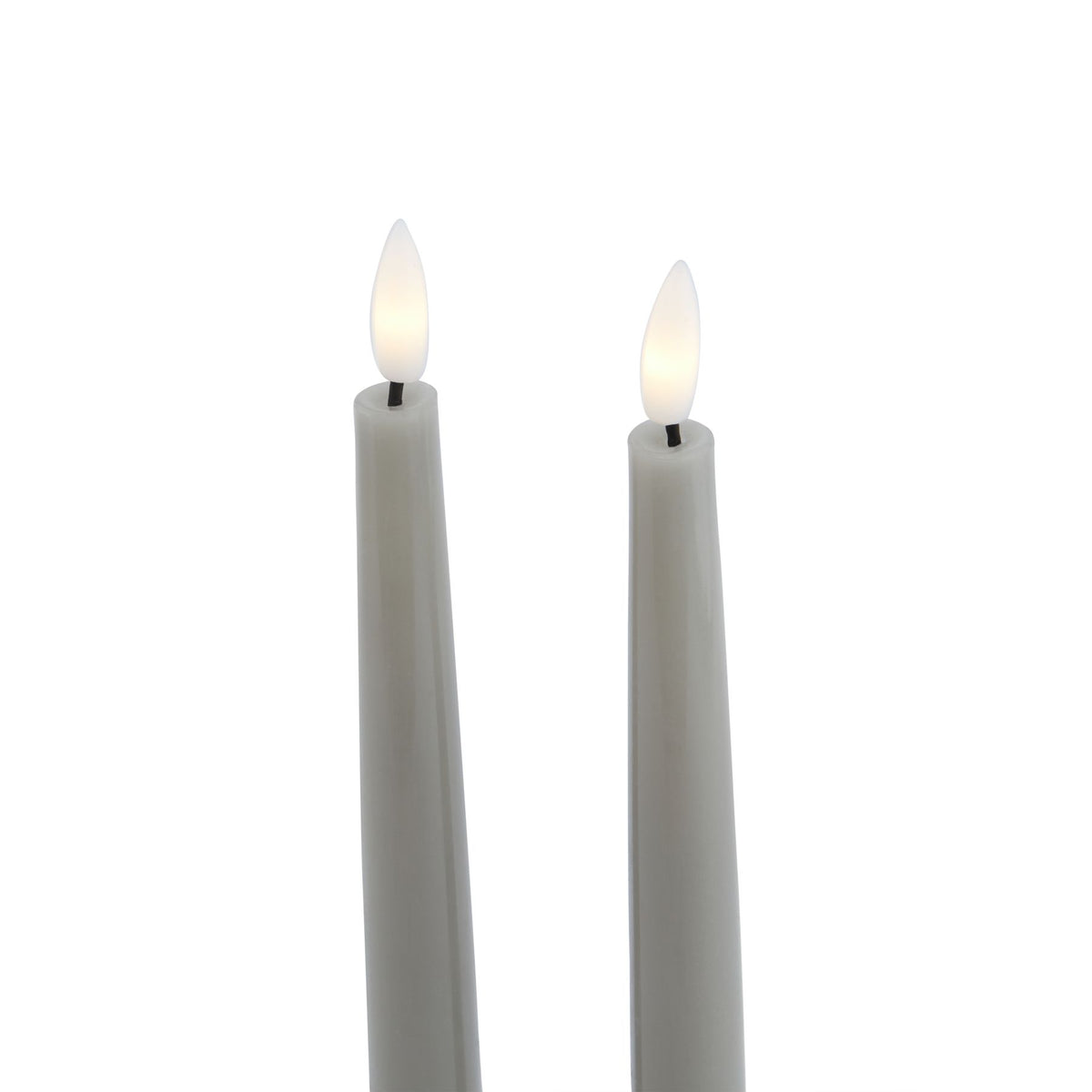 Close-up of the grey candle tops, showing white flame-shaped inserts with pale yellow centres on short dark stems.