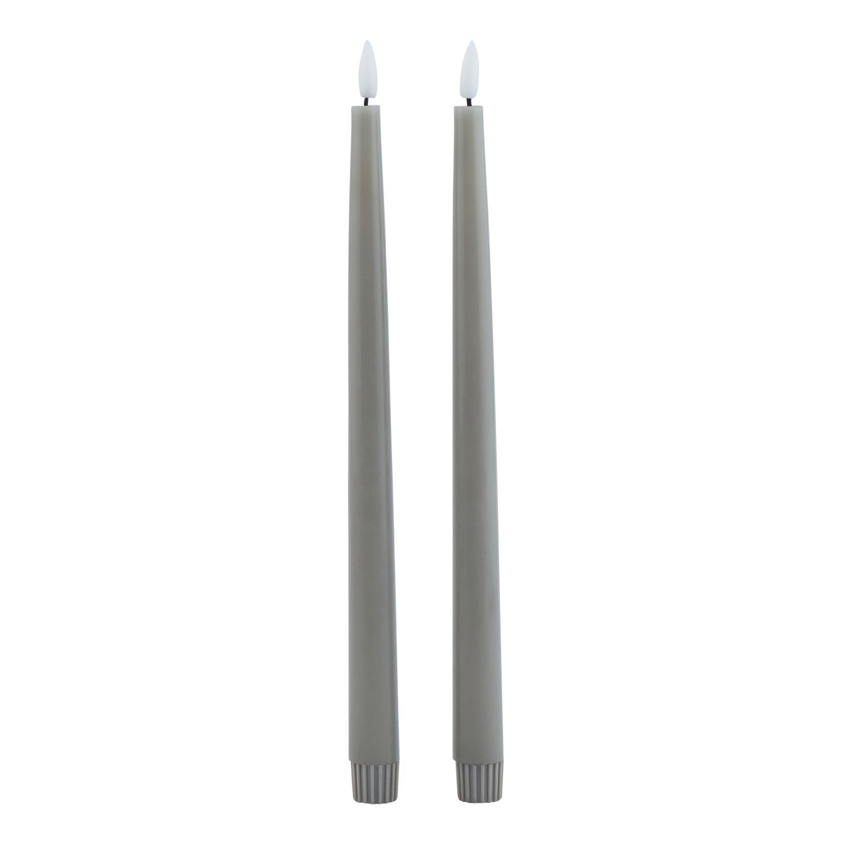 Two slim grey dinner candles shown in full against white, with white flame-shaped tips and ribbed lower sleeves.