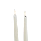 Close-up of the upper portions of two pale LED candles, showing white flame-shaped inserts with warm white centres above short dark stems.