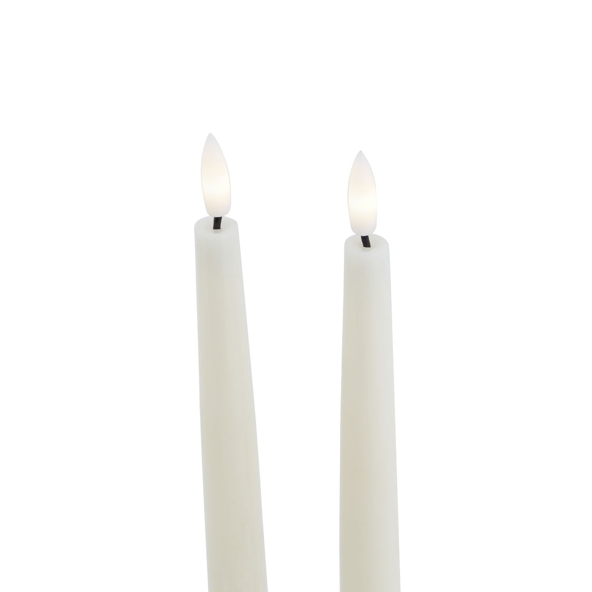 Close-up of the upper portions of two pale LED candles, showing white flame-shaped inserts with warm white centres above short dark stems.
