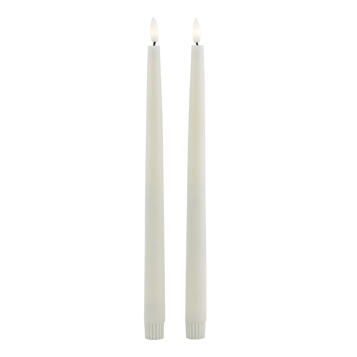 Full-length view of two pale LED dinner candles with fluted lower caps and flame-shaped inserts pictured with warm white centres.