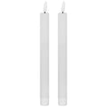 Two matching unlit white LED dinner candles with slender bodies, fluted lower sleeves and white flame-shaped tips on dark stems.