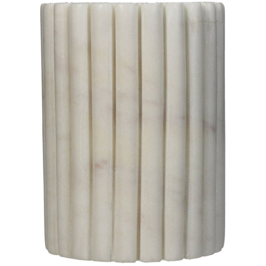 Side view of the cylindrical toothbrush holder showing pale marble veining across the fluted surface.