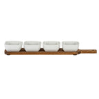 Front view of the serving board and four white bowls in a straight row, showing the board's narrow edge and handle with a circular hole.