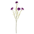 Full view of an artificial purple flower spray with four layered blooms, branching green stems and slender leaves against white.
