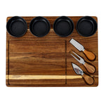 Overhead view of the cheese board showing four charcoal bowls across the top, a large outlined area on the left and three utensils on the right.