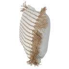 Angled side view showing the cushion's woven striped front, tan fringe and plain ivory reverse.