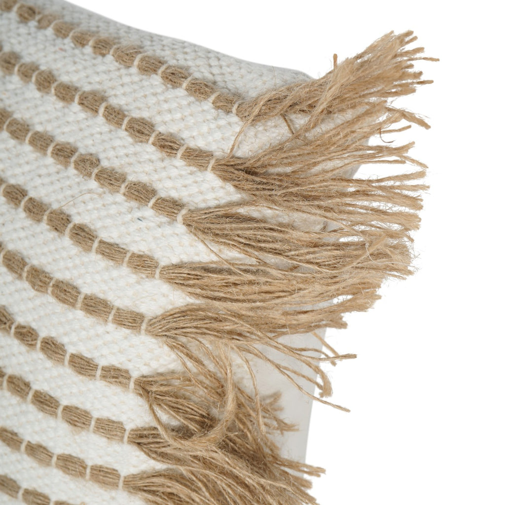 Close-up of tan strands extending from the stitched rows into loose fringe at the cushion edge.
