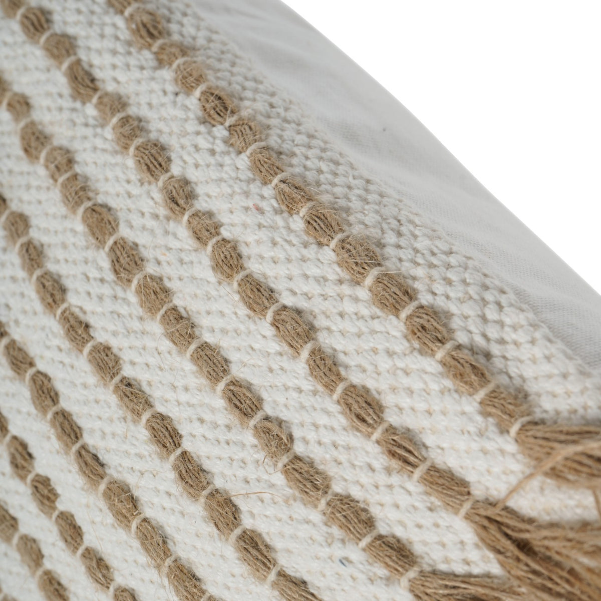 Close-up of the ivory weave and raised tan rows held by pale stitches, beside the smooth ivory backing.