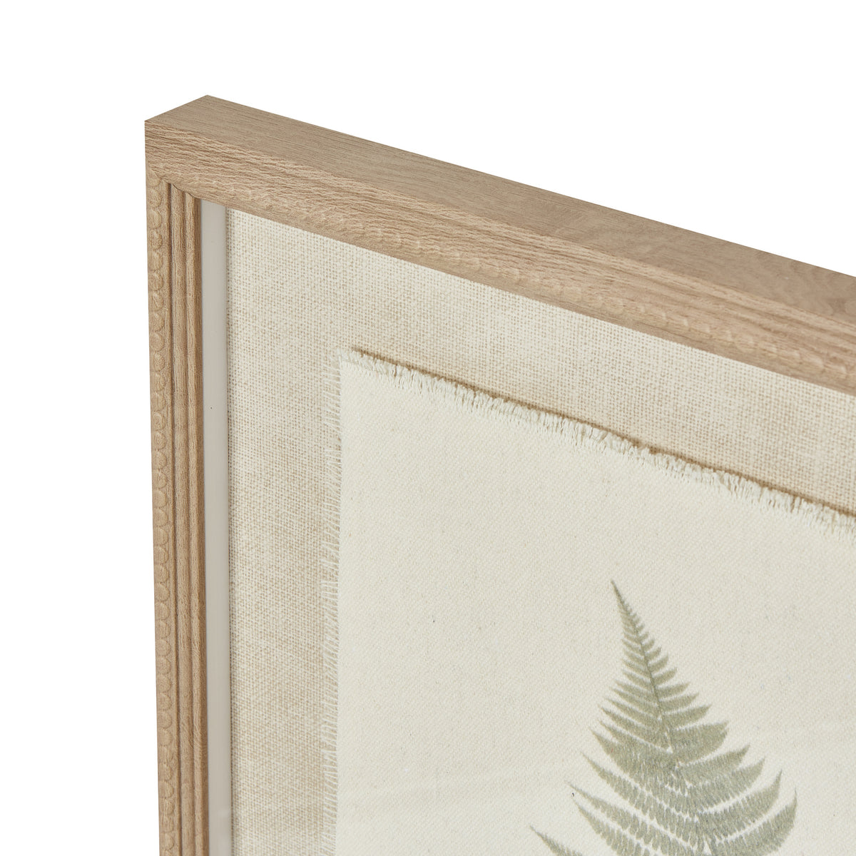 Angled detail of the tan frame's upper corner, showing the beaded border and frayed edge of the pale inner panel.