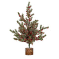Full view of an artificial tree with spreading green branches, red and black berries, white frosting and a cylindrical bark-like base.
