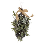 Full view of a tapered frosted foliage swag with olive-green leaves, white berries, a tan bow with trailing ribbon and a brown hanging loop against white.