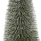Close-up of the brush tree's dense radiating branch tiers, showing the textured white frosting along the dark green bristles.