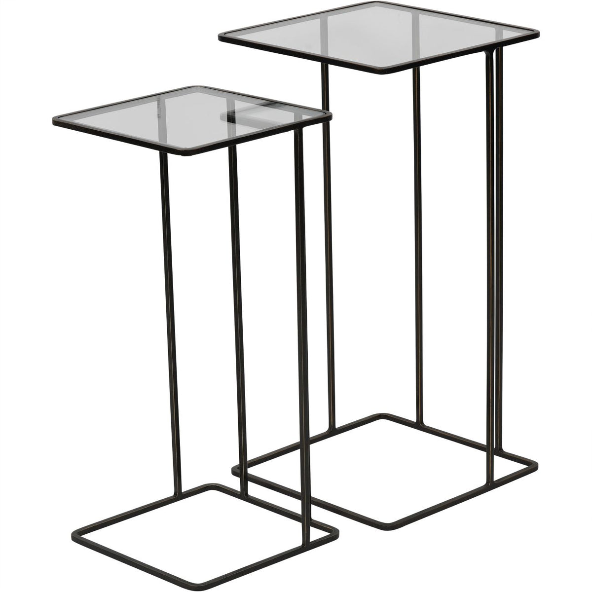 Two bronze nesting side tables drawn apart, with the smaller glass-topped table in front of the taller one.