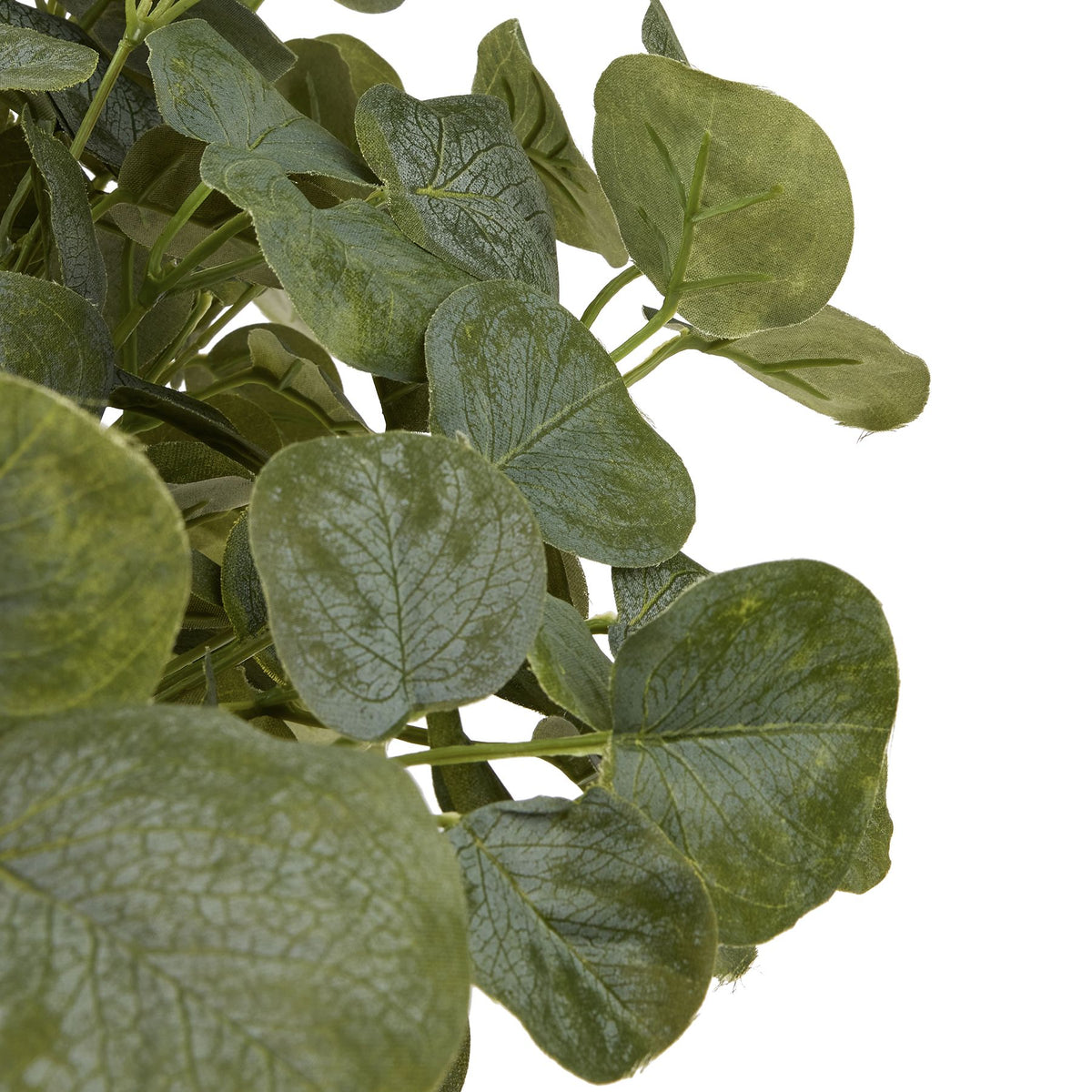 Close-up of overlapping Coinleaf artificial leaves, showing fine vein patterns, textured surfaces and varied green tones.