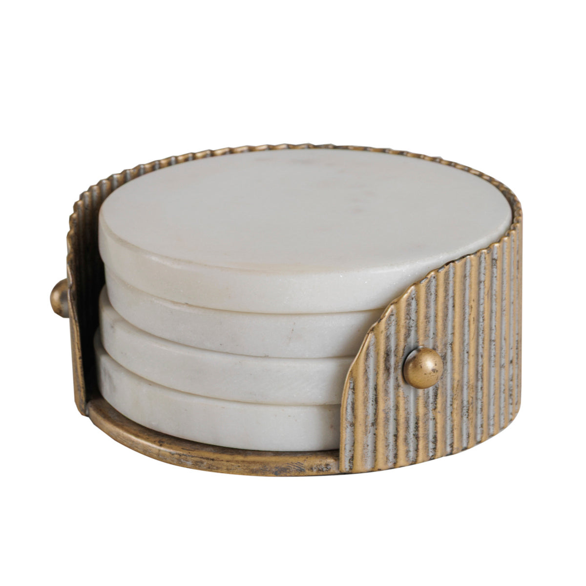 Angled view of stacked white marble coasters showing the holder’s curved ribbed side and gold stud detail.