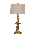 Gold-coloured table lamp with a ringed column, projecting circular disc and flared round base beneath a tapered cream textured shade, shown against white.