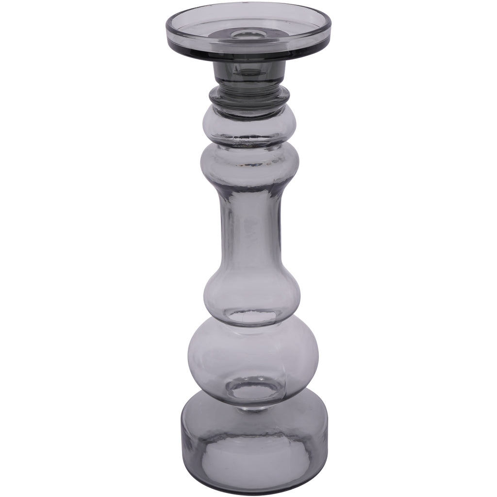 Large smoky grey glass candle holder viewed from the front, with a rounded shaped stem and circular platform.
