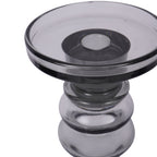 Angled close-up of the glass candle platform, showing its raised rim, central recess and rounded upper stem.