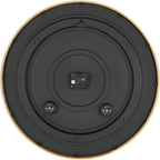 Rear view of the clock showing a black circular back, central battery compartment and hanging slot near the top.