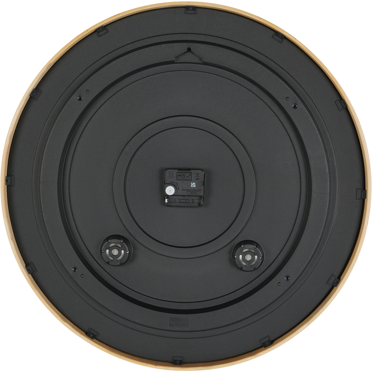 Rear view of the clock showing a black circular back, central battery compartment and hanging slot near the top.