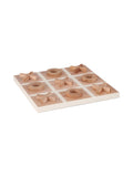Angled view of a square noughts-and-crosses board with a pale grid and raised wooden X and O pieces, showing visible wood grain against a white background.