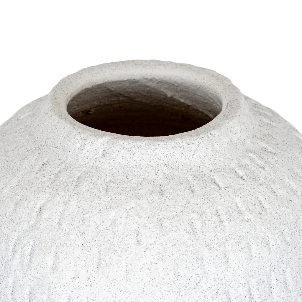 Close-up of the vase's wide circular mouth and sloping shoulders, showing the speckled rim and shadowed interior.