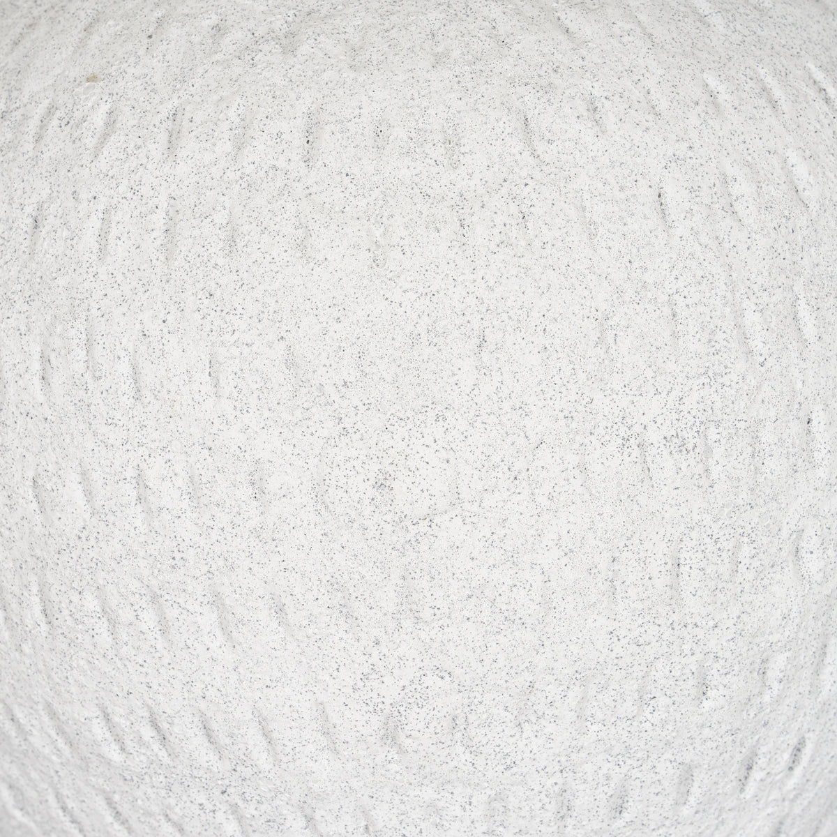 Detail of the vase's granular off-white exterior, with fine grey speckles and shallow uneven vertical markings.