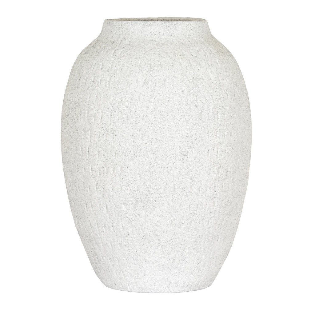 Off-white vase with an elongated rounded body, sloping shoulders and fine vertical marks against a white background.