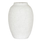Off-white vase with an elongated rounded body, sloping shoulders and fine vertical marks against a white background.