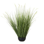 Artificial grass plant with dense green blades fanning out around pale seed heads above a low rounded black pot.
