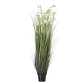 Full view of a tall artificial arrangement with upright grey-green grass and scattered white flowers in a black tapered pot.