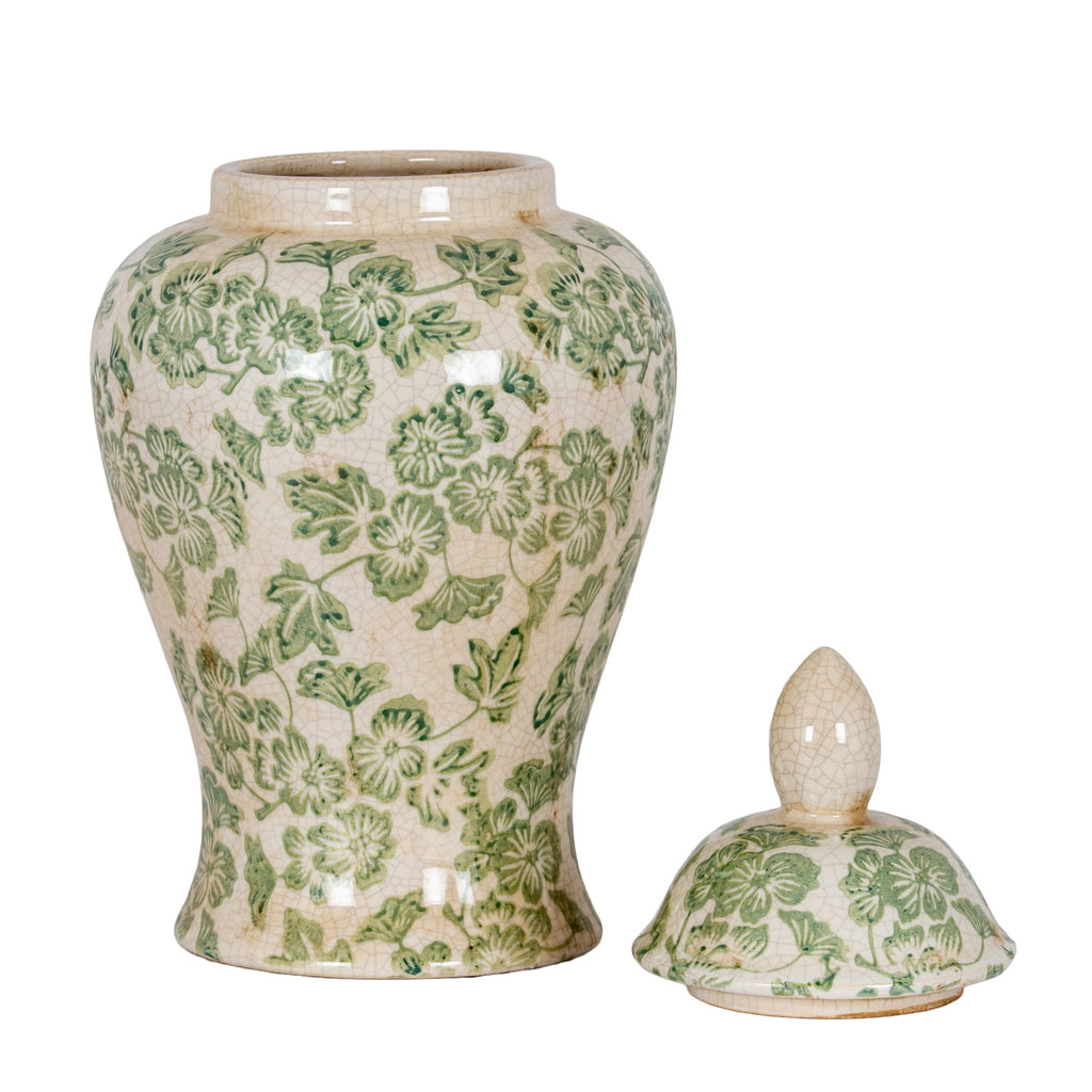 Open green floral ginger jar with its lid placed beside it, revealing the raised neck and rounded shoulder.
