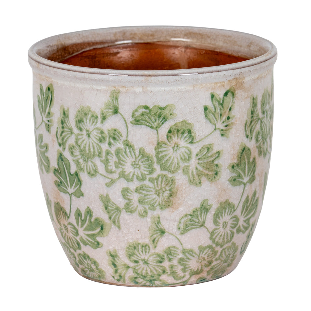 Green floral cylindrical planter with a cream-white crackled exterior, rolled rim and visible terracotta-brown interior.