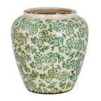 Rounded vase with green flowers and leaves across a cream crackled surface, with dark distressed edging at the rim and base.