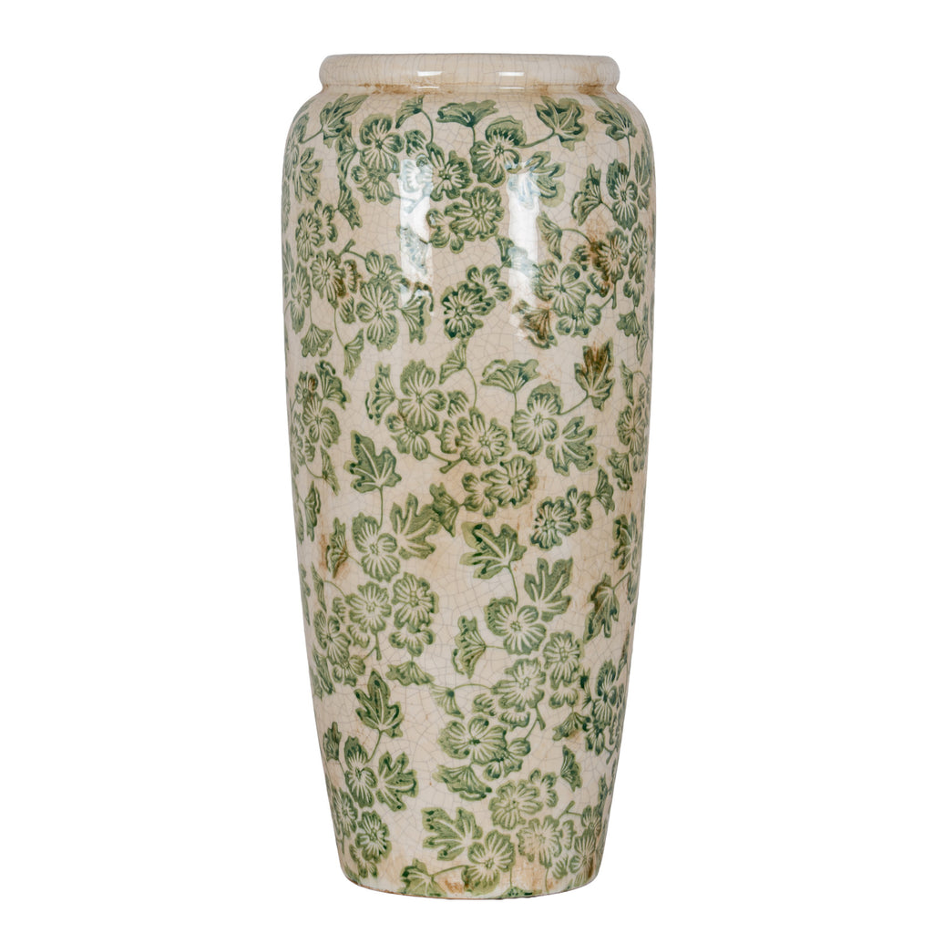 Tall cream-white vase with green flowers and trailing leaves, a rounded shoulder and gently tapering sides against a white background.