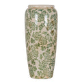 Tall cream-white vase with green flowers and trailing leaves, a rounded shoulder and gently tapering sides against a white background.
