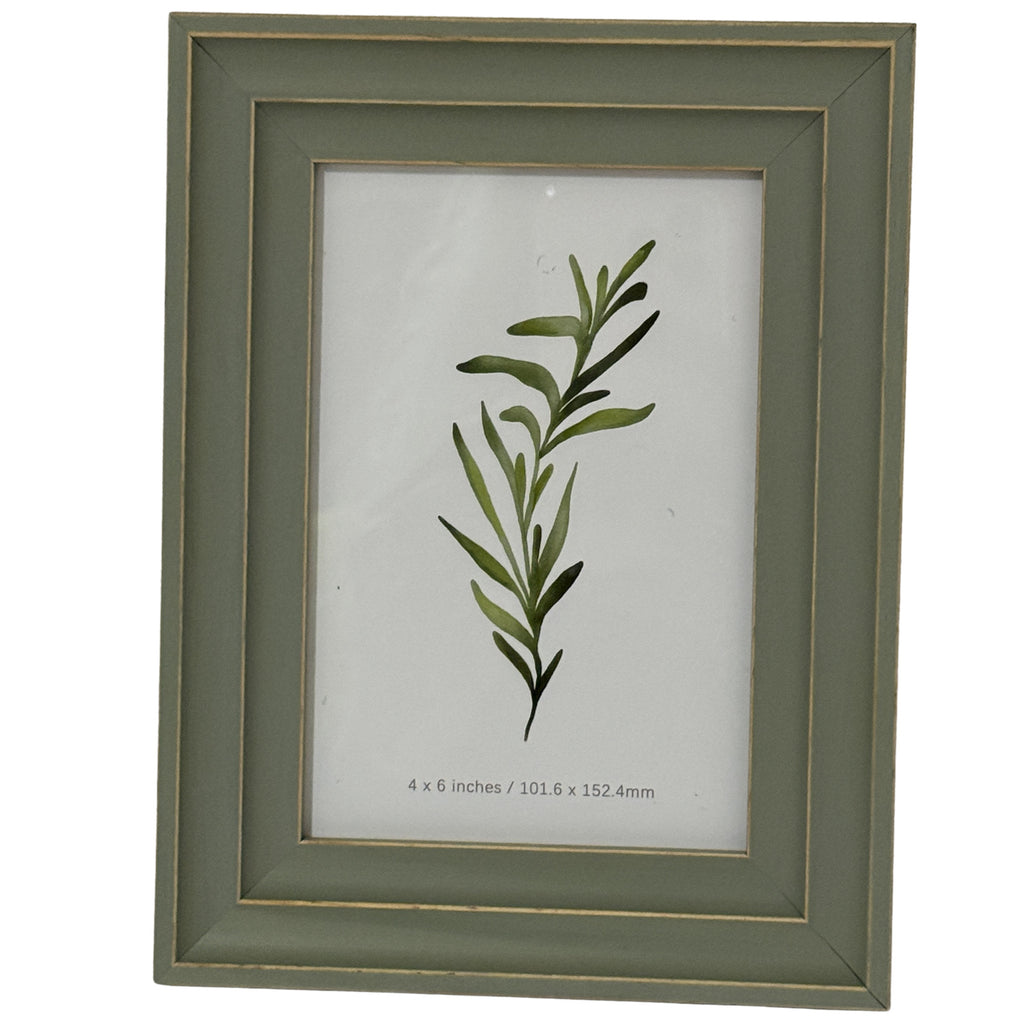Front view of a green-grey rectangular photo frame with a layered surround, thin gold-tone lines and a leafy botanical insert marked 4 x 6 inches.