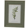 Front view of a green-grey rectangular photo frame with a layered surround, thin gold-tone lines and a leafy botanical insert marked 4 x 6 inches.