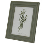 Angled view of the green-grey photo frame showing its squared layered border, gold-tone outlines and leafy botanical insert.