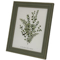 Angled front view of the green-grey rectangular photo frame, with a layered gold-tone lined surround and a botanical printed insert.