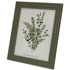 Angled front view of the green-grey rectangular photo frame, with a layered gold-tone lined surround and a botanical printed insert.